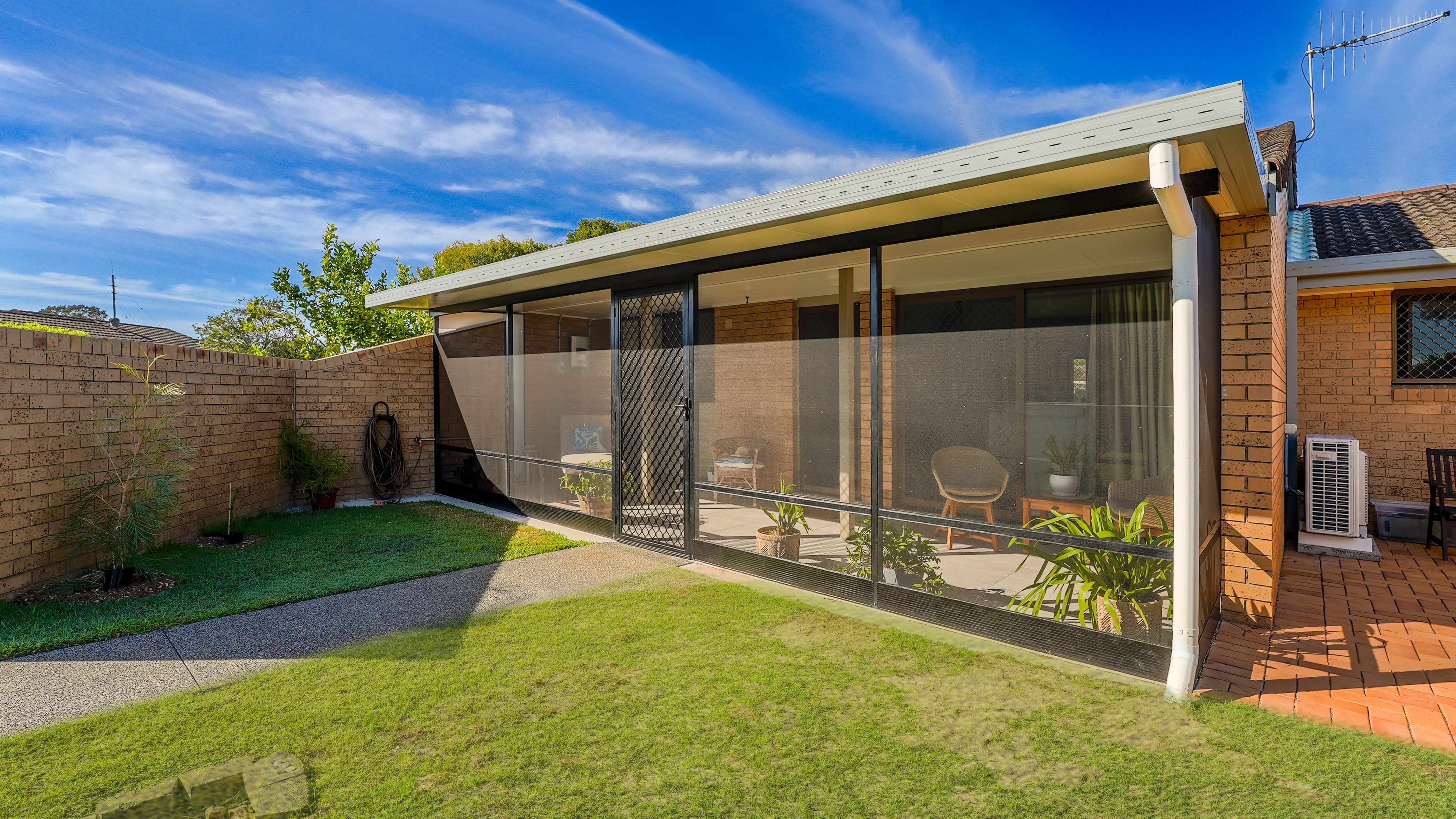 screened outdoor room of villa at Crowley Care