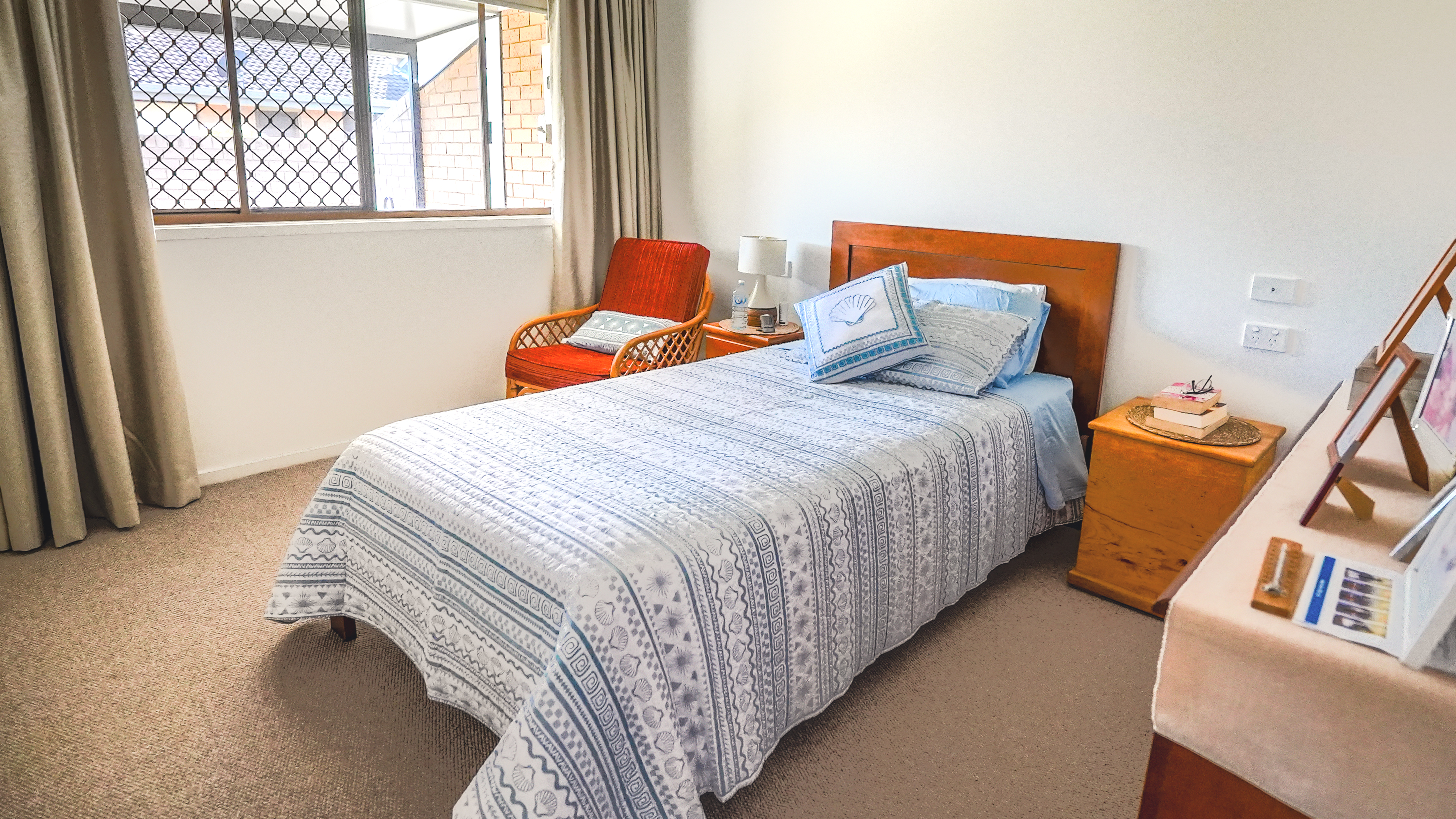furnished bedroom with single bed in villa at Crowley Care